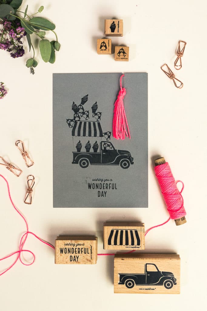 Greeting card with stamped ice cream van and happy penguins